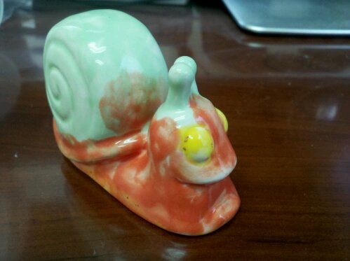 Ceramic snail by 8 yr old